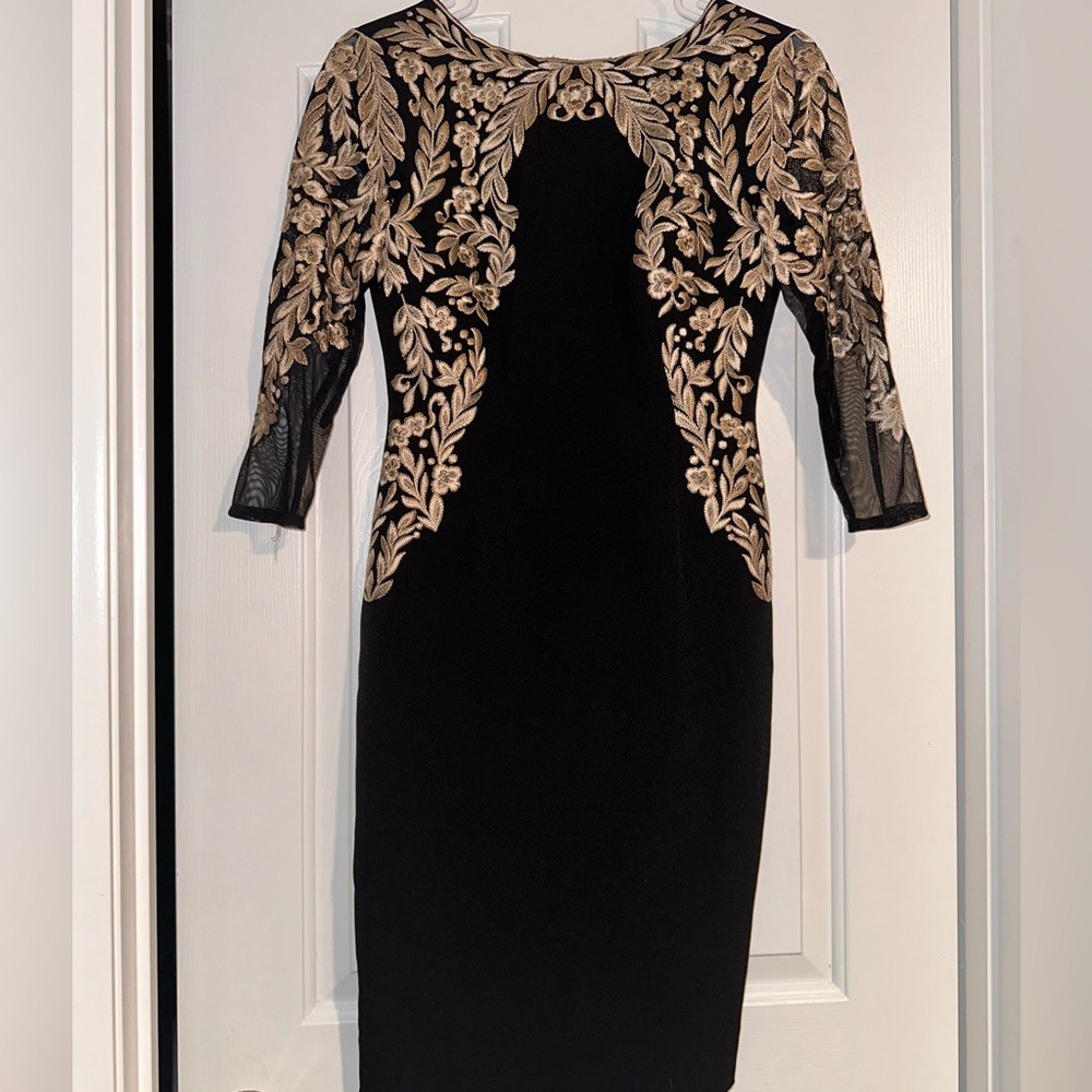 Black cocktail dress with gold details